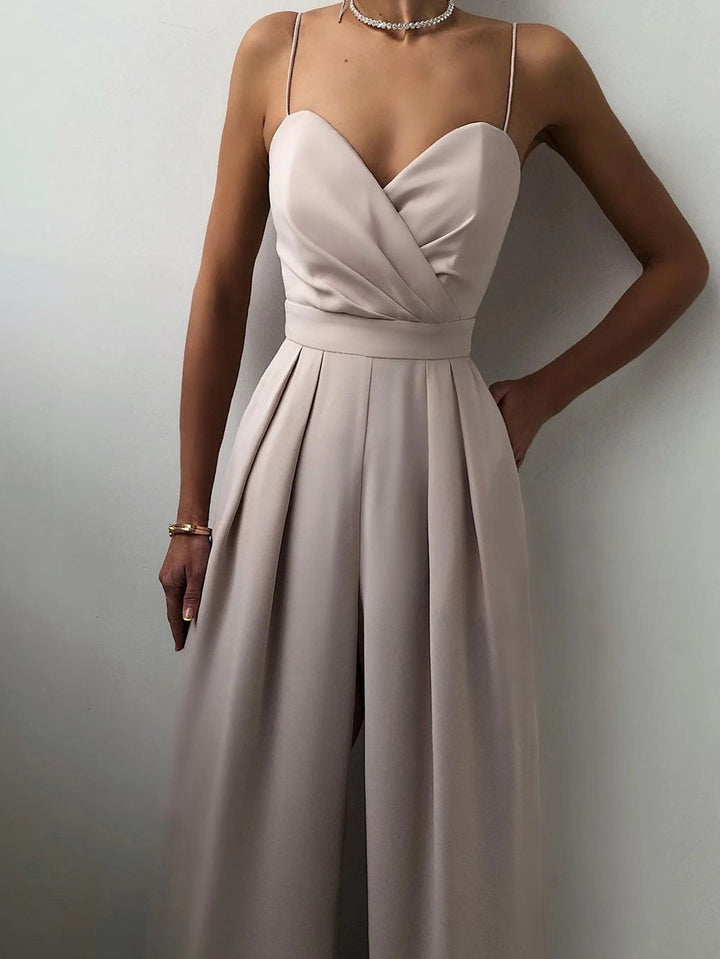 Modny damski kombinezon w jednolitym kolorze z szerokimi nogawkami i szeroką talią, bez rękawów i szelkami