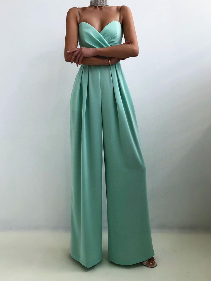 Modny damski kombinezon w jednolitym kolorze z szerokimi nogawkami i szeroką talią, bez rękawów i szelkami