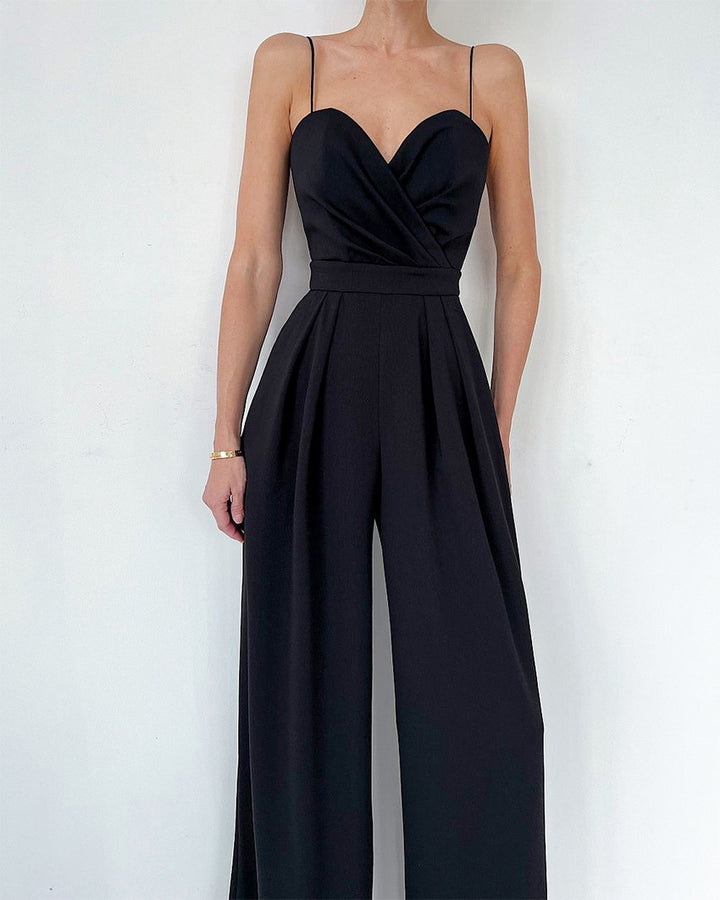 Modny damski kombinezon w jednolitym kolorze z szerokimi nogawkami i szeroką talią, bez rękawów i szelkami