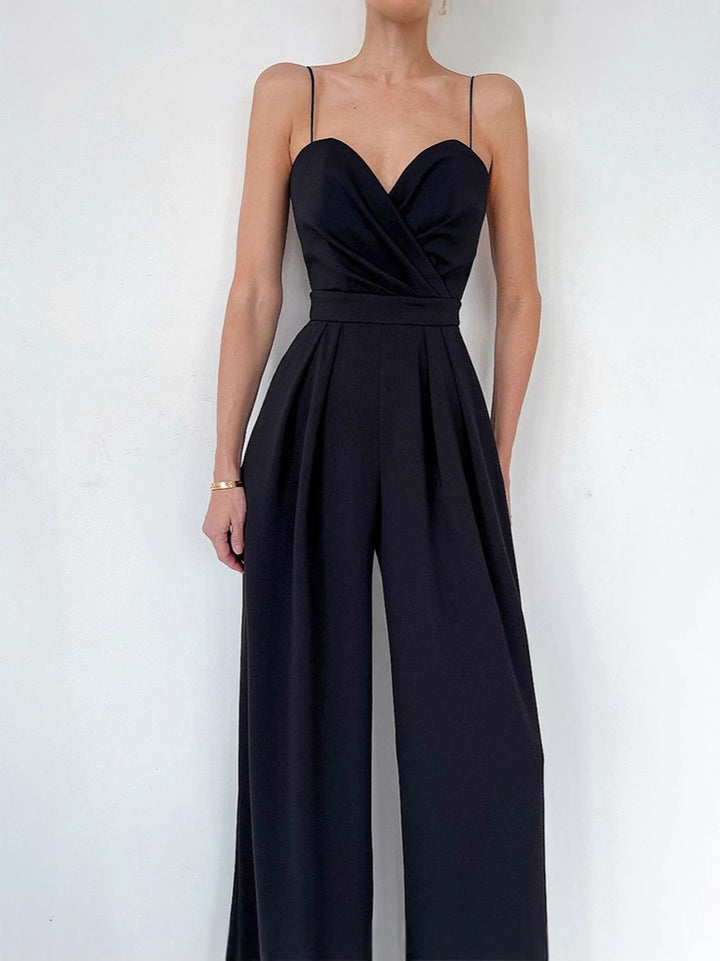 Modny damski kombinezon w jednolitym kolorze z szerokimi nogawkami i szeroką talią, bez rękawów i szelkami